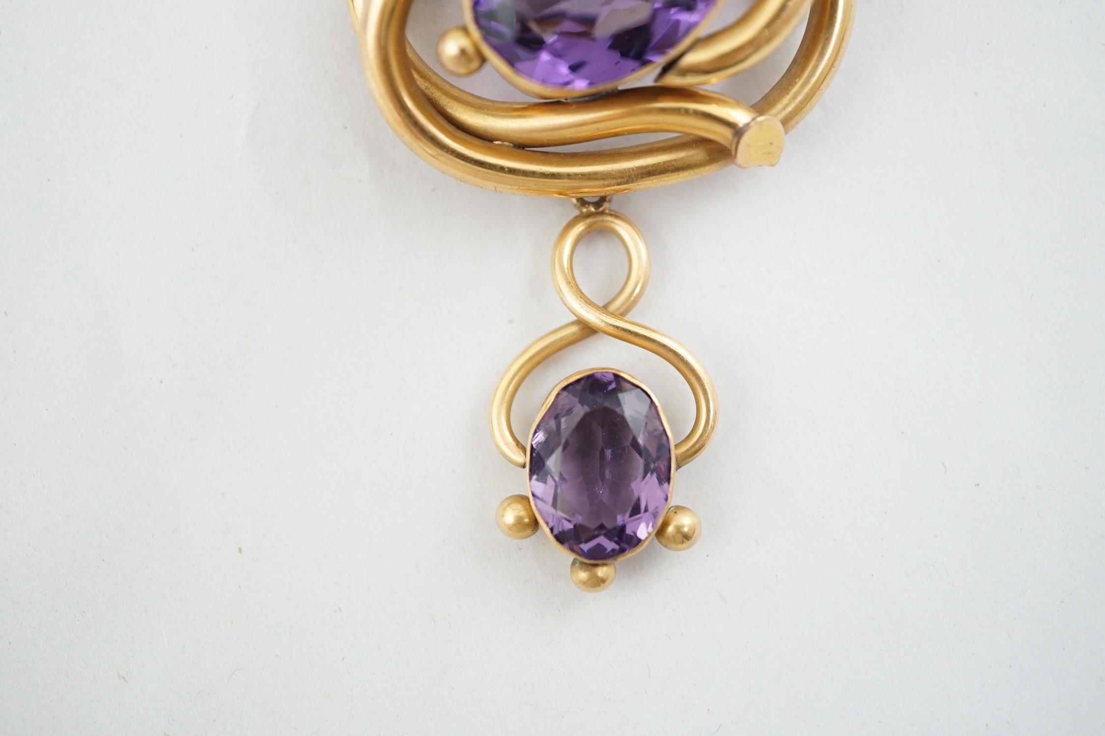 A Victorian gilt metal and two stone amethyst set drop brooch